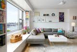 A view of the living room with the East River in the distance. 