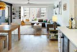 The bar and the dining table tie the living spaces together. 