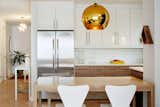 A bright kitchen replaces the closed off dark and very small gallery kitchen. 