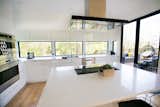 Modern kitchen with 180 degree views of the trees and Geist Reservoir