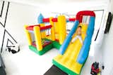 In-Home studio offers multi-functional space for not only photography, but also indoor tennis and a bounce house!