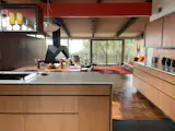 The new open kitchen was based on the original design and built by hand by John Vugrin