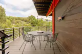 A deck surrounds the lower level and the steel structure