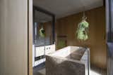 Bath Room, Vessel Sink, Light Hardwood Floor, Stone Tile Wall, and Freestanding Tub  Photo 11 of 16 in Clerkenwell Close by Webb Yates Engineers