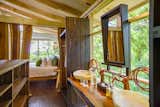 The bathroom is equipped with handcrafted copper tubing, made by local artisans.