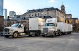 These are two of our trucks and they help us deliver containers right to where you need them.