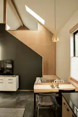 Dining area with stairs to loft bedroom