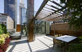 Outdoor, Wood Fences, Wall, Rooftop, Large Patio, Porch, Deck, Raised Planters, Shrubs, Small Pools, Tubs, Shower, and Tile Patio, Porch, Deck Rooftop terrace   Photo 8 of 9 in Flatiron Penthouse by Charles Rose Architects