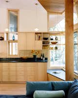 Kitchen, Stone Slab Backsplashe, Light Hardwood Floor, Pendant Lighting, Stone Counter, and Wood Cabinet  Photos from Chilmark House