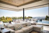 Trousdale Beverly Hills luxury home open air living room with sliding glass walls