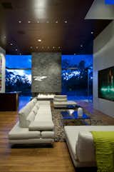 Summit House Beverly Hills modern luxury home open volume living room with stacked stone fireplace