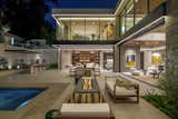 Hutton Drive 2641 Beverly Hills luxury resort style home with sliding glass walls and indoor outdoor design that opens onto the backyard pool terrace and lounge