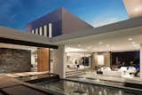 Benedict Canyon Beverly Hills luxury mansion with modern entrance pond and glass walls