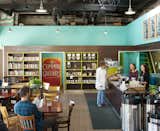 Interior of coffee house built in a converted garage and service station. 