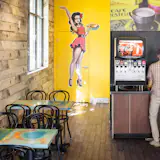 Custom tables by Platform Workshop. Metal wrapped cabinets by Design Platform for soda station. 