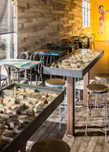 Community tables and custom painted table tops by Platform Workshop. 