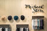 Feature wall by Platform Workshop with custom made shelving and fixtures designed and built specially for Michael Stars. 