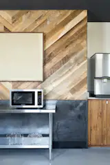 Detail of herringbone reclaimed wall and hot rolled steel. 