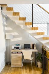 This home had a very small 800 sf original footprint. We did not want to waste any available space so the area under the staircase was outfitted for a small office space. 