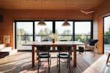 Expansive southern glazing brings light into the living space throughout the day.   Photo 10 of 19 in Cabin on the Vistula by Nate Cook Photography