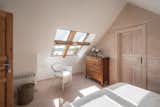 Skylights in the master bedroom provide glimpses of the river.   Photo 11 of 19 in Cabin on the Vistula by Nate Cook Photography