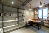 Office, Study Room Type, Library Room Type, Bookcase, Chair, Lamps, Storage, Shelves, Desk, and Medium Hardwood Floor Office  Photos from INTERIOR IN THE INDUSTRIAL CONSTRUCTION HOUSE