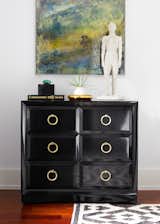 Moment in the guest room with a vintage Widdicomb chest of drawers with a Timothy Poe Diptych mirror hanging above.