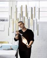 ILAN EL with a Heavy Rain Chandelier at the background 