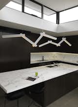 Kitchen, Pendant Lighting, Marble Counter, and Marble Backsplashe  Photos from The Prahran House