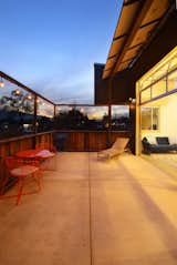 Outdoor, Walkways, Rooftop, Large Patio, Porch, Deck, Concrete Patio, Porch, Deck, Vertical Fences, Wall, Wood Fences, Wall, Metal Fences, Wall, and Hanging Lighting Upper patio  Photo 2 of 8 in The Stella House by Baron Hersh