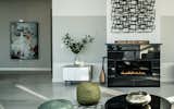 The H Series Millennium vent-free fireplace with reflective black enamel interior and Absolute Black granite surround. Photo courtesy of MP Boston.