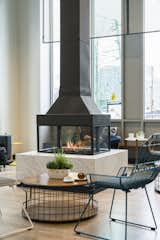 A unique focal point: This 4 sided fireplace by Element4 features views of the fire from all 4 sides.  This is a wonderful design feature for large, communal, spaces.
