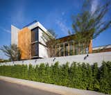 Exterior, Green Siding Material, Glass Siding Material, Flat RoofLine, Wood Siding Material, Concrete Siding Material, and House Building Type  Photo 4 of 63 in LADPRAO 80 by Black Pencils Studio