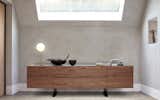 A warm walnut surface and classic black marble from the Aegean, united by contrast. The board has been inserted into the body with miter joints. The MOUNT sideboard is powerful, resolute and, thanks to its T-feet, seems to hover over the ground.

MOUNT sideboard 
Design: Gil Coste 
Photo and Styling: Peter Fehrentz