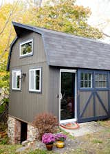 The windows and exterior lighting, and the sliding glass doors were added during the renovation  Photo 13 of 21 in OUTBUILDING OFFICE by Pamela Dailey