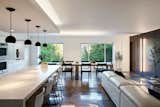This pied-à-terre may be compact, but it's efficient! Susan can have a sit down dinner for 20 in this entertainer's dream space! The enormous peninsula seats 6 while the 12' long dining table can seat up to 14. The Dekton countertops allow Susan to place hot pans directly on the surface without fear of yellowing, and spill all the red wine she wants without staining!