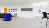 Wilkens Design Studio custom home design in Seattle with Pedini Kitchen integrated into open-plan main floor.