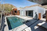 Outdoor, Swimming Pools, Tubs, Shower, Trees, Walkways, Back Yard, Grass, Small Patio, Porch, Deck, Small Pools, Tubs, Shower, Shrubs, Concrete Patio, Porch, Deck, Concrete Fences, Wall, Metal Patio, Porch, Deck, Metal Fences, Wall, Landscape Lighting, and Desert  Photo 18 of 24 in The Atrium House by Cody Carpenter