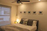 Bedroom, Bed, Ceiling Lighting, Porcelain Tile Floor, Recessed Lighting, Table Lighting, and Night Stands  Photo 15 of 17 in The Cali Apartment by Dwayne Watson