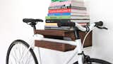Finding a place to store larger items that are used daily is challenging. Thankfully, a beautifully crafted shelf like this from Knife and Saw elevates (both literally and figuratively) your commuter bike to the realm of sculptural art. It also provides room for your coffee table books.