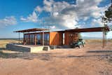 This Texas modular, dubbed the Marfa Weehouse, provides sweeping views from its sheltered deck.  Conceptualized as the first in a three dwelling compound, this home shelters a bedroom, bathroom and a covered utility shed.  Search “WeeHouse” from 5 Hot Tips to Remember When Planning Your Desert Prefab