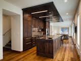 Custom metal ceiling defines kitchen