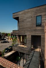 Wood Patio, Porch, Deck, Decking Patio, Porch, Deck, Metal Patio, Porch, Deck, Small Patio, Porch, Deck, Exterior, Sliding Door Type, Casement Window Type, Staircase, Glass Railing, and Metal Railing View of veranda and bridge  Photo 7 of 43 in Taphouse by GriD