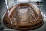 Custom walnut bathtub, with jet inserts for a dreamy spa experience.