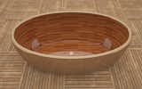 This unique tub, designed by Nathie Katzoff of NK Woodworking & Design, has a Sapele wood interior, and a modern copper exterior.
