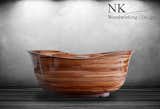 Our custom "Petite Lotus" bathtub, made from walnut and sapele mahogany. It is a smaller 5ft version of the larger Lotus tub we made.