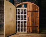 Patented arch design constructed from reclaimed barn wood (Douglas Fir) and hand forged handles.