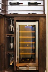 A wine refrigerator was added so the client can always have white wine and champagne chilled and ready to drink.