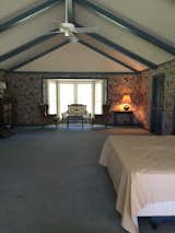 The Master Bedroom when we purchased the home. It was owned by a widowed millionaire who basically did no renovations or updates after his wife's death in the early 1990's. The Master Bedroom is over 900 sq ft with a vaulted/beamed ceiling (painted "country blue"). 