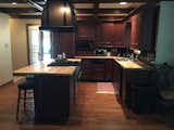 The before kitchen with dark wood and paint